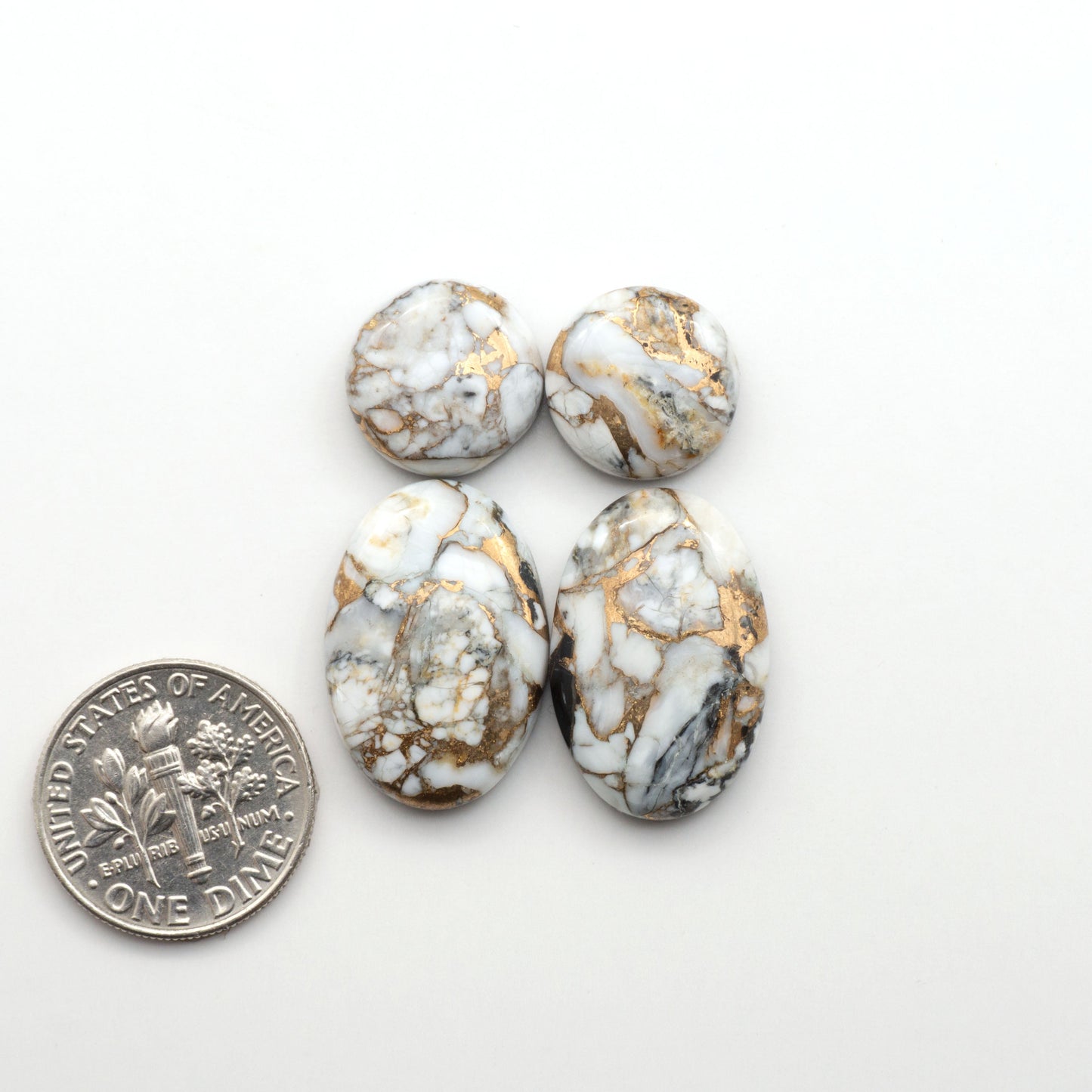Elevate your jewelry pieces with these stunning White Buffalo Cabochons. With their unique and intricate patterns, they add a touch of elegance to any design.