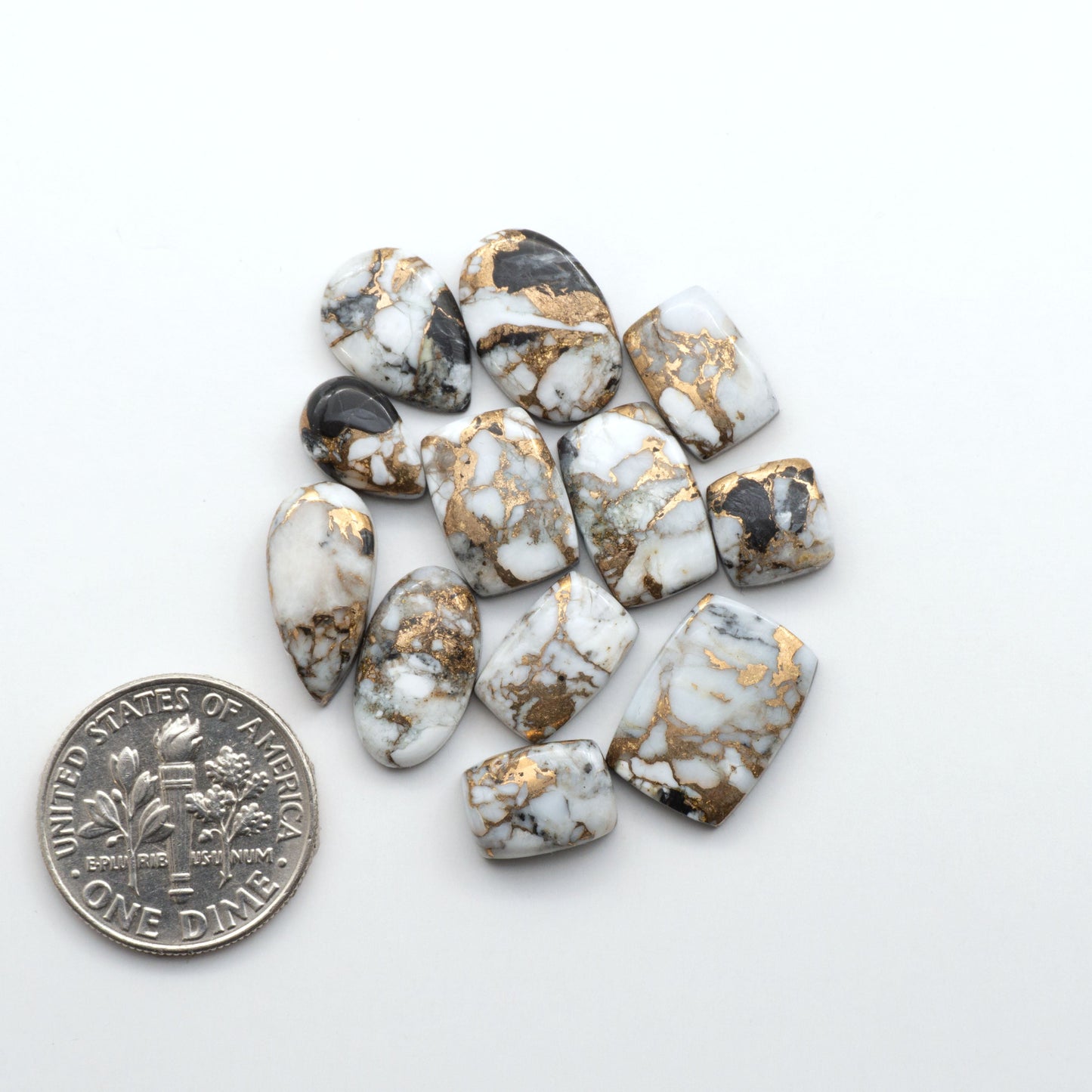 Elevate your jewelry pieces with these stunning White Buffalo Cabochons. With their unique and intricate patterns, they add a touch of elegance to any design.
