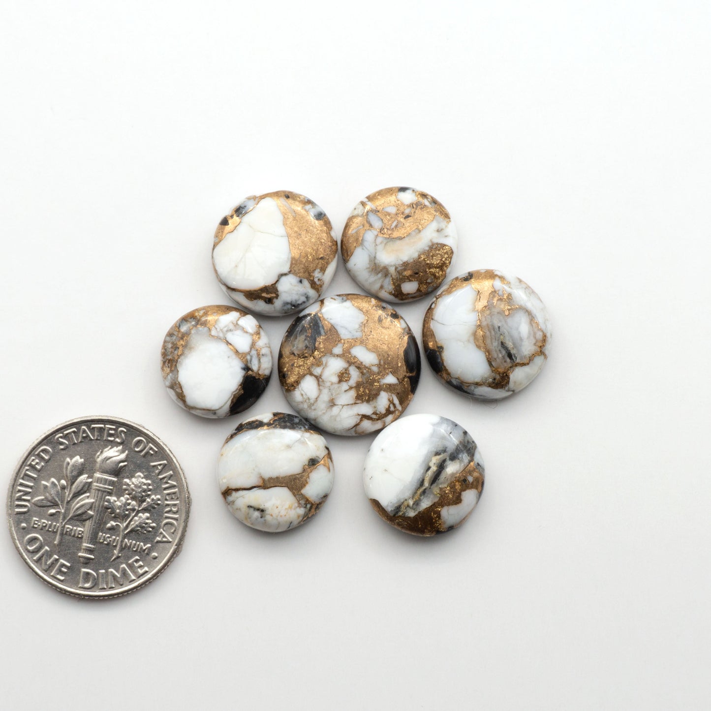 Elevate your jewelry pieces with these stunning White Buffalo Cabochons. With their unique and intricate patterns, they add a touch of elegance to any design.