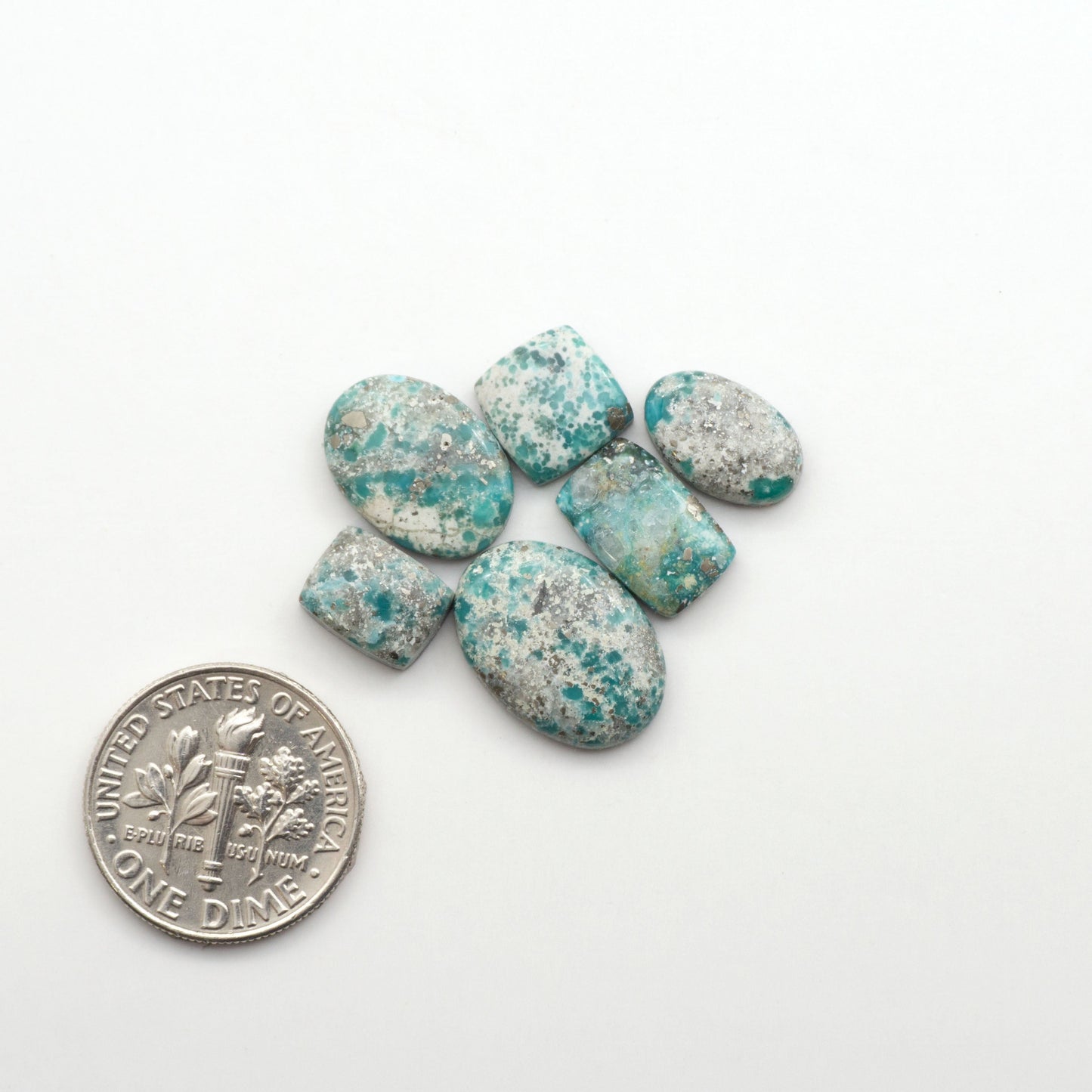White Water Turquoise Cabochons with their mesmerizing patterns and one-of-a-kind colors, are perfect for those looking for a unique and eye-catching piece.