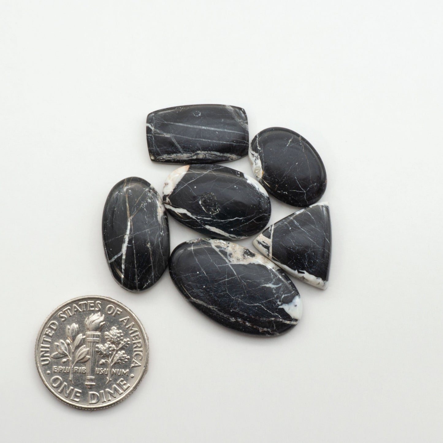 Natural White Buffalo Stone Cabochons are semi-precious gemstones cut into shapes ideal for jewelry-making, making them an excellent choice for artisans.