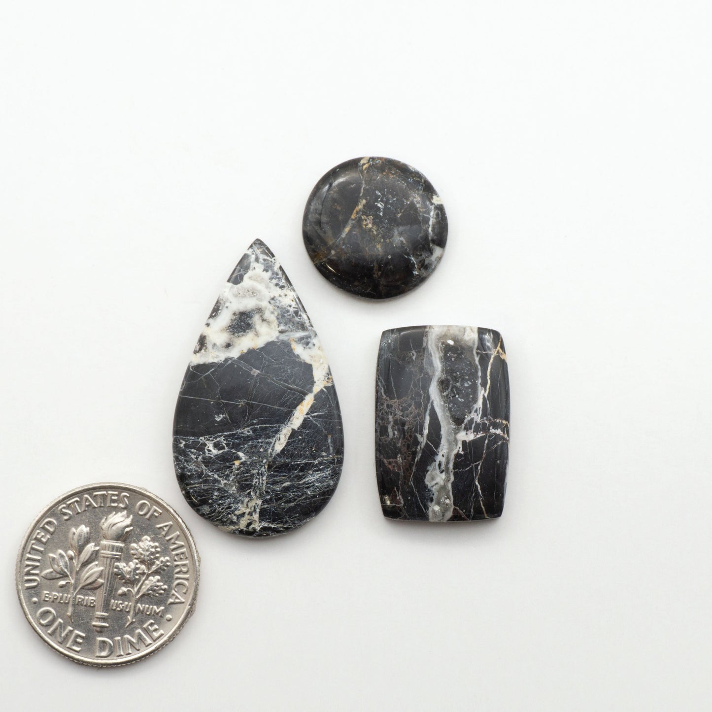 Natural White Buffalo Stone Cabochons are semi-precious gemstones cut into shapes ideal for jewelry-making, making them an excellent choice for artisans.