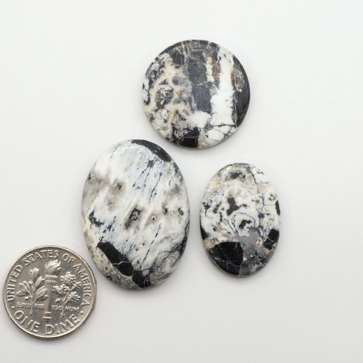 Natural White Buffalo Stone Cabochons are semi-precious gemstones cut into shapes ideal for jewelry-making, making them an excellent choice for artisans.