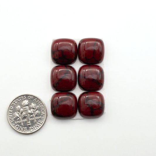 Bloody Bison Jasper is a composite stone with a vibrant red hue and black matrix that creates a strong impression and a touch of opulence to any jewelry piece.