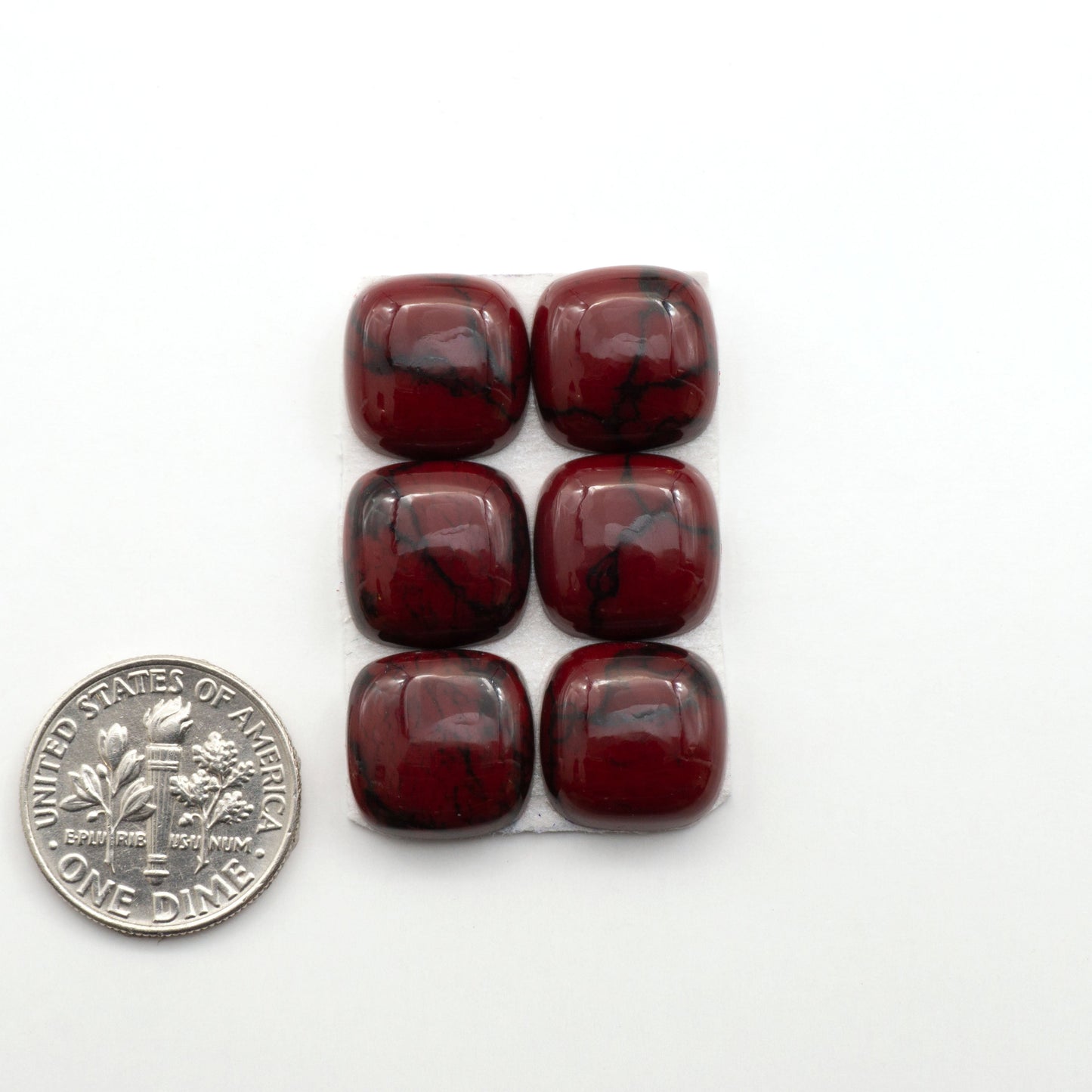 Bloody Bison Jasper is a composite stone with a vibrant red hue and black matrix that creates a strong impression and a touch of opulence to any jewelry piece.