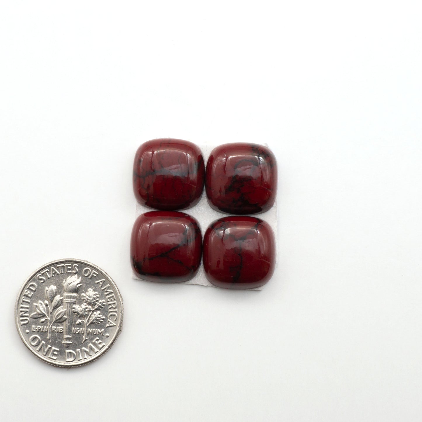 Bloody Bison Jasper is a composite stone with a vibrant red hue and black matrix that creates a strong impression and a touch of opulence to any jewelry piece.
