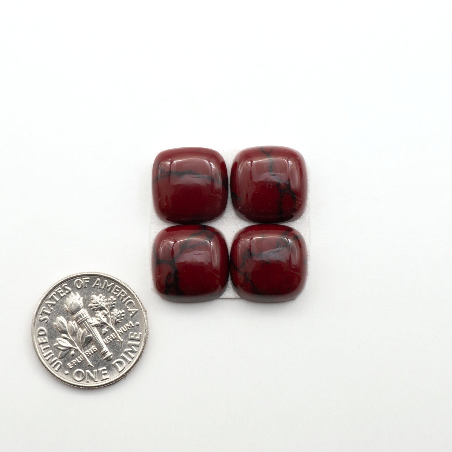 Bloody Bison Jasper is a composite stone with a vibrant red hue and black matrix that creates a strong impression and a touch of opulence to any jewelry piece.