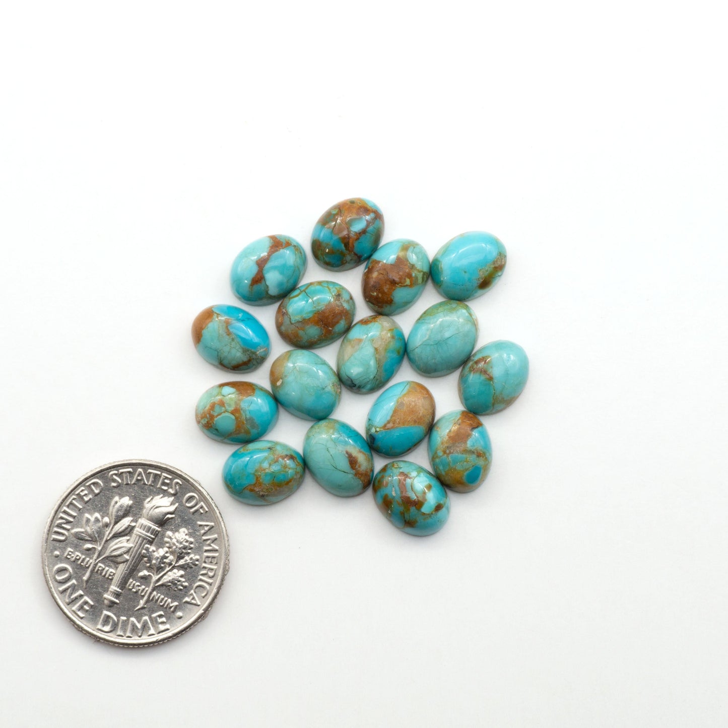 Enhance your jewelry designs with Pressed Turquoise Nugget Cabochons. Crafted from composite materials they add a captivating touch to your creations.