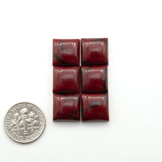 Bloody Bison Jasper is a composite stone with a vibrant red hue and black matrix that creates a strong impression and a touch of opulence to any jewelry piece.