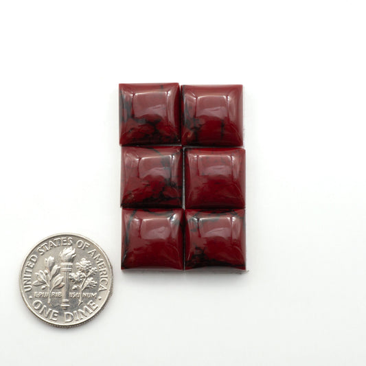Bloody Bison Jasper is a composite stone with a vibrant red hue and black matrix that creates a strong impression and a touch of opulence to any jewelry piece.