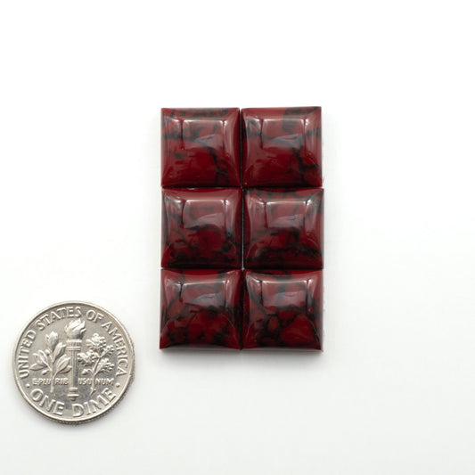 Bloody Bison Jasper is a composite stone with a vibrant red hue and black matrix that creates a strong impression and a touch of opulence to any jewelry piece.