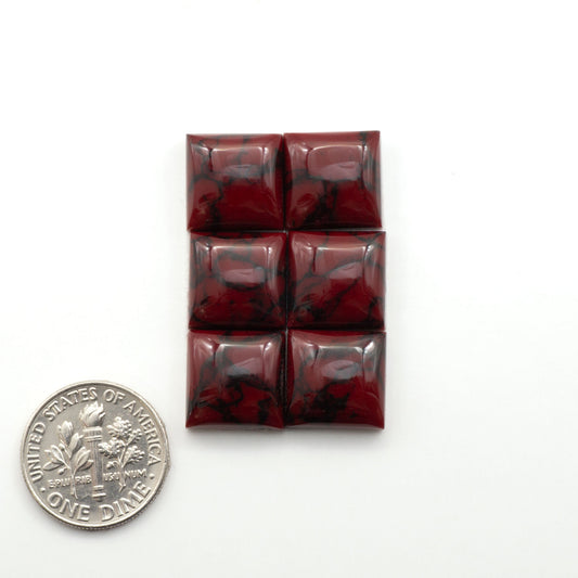 Bloody Bison Jasper is a composite stone with a vibrant red hue and black matrix that creates a strong impression and a touch of opulence to any jewelry piece.