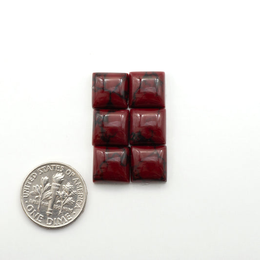 Bloody Bison Jasper is a composite stone with a vibrant red hue and black matrix that creates a strong impression and a touch of opulence to any jewelry piece.