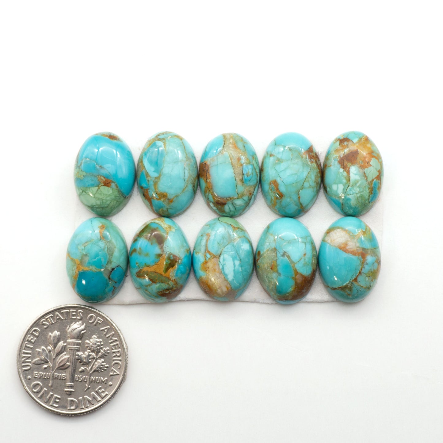 Enhance your jewelry designs with Pressed Turquoise Nugget Cabochons. Crafted from composite materials they add a captivating touch to your creations.