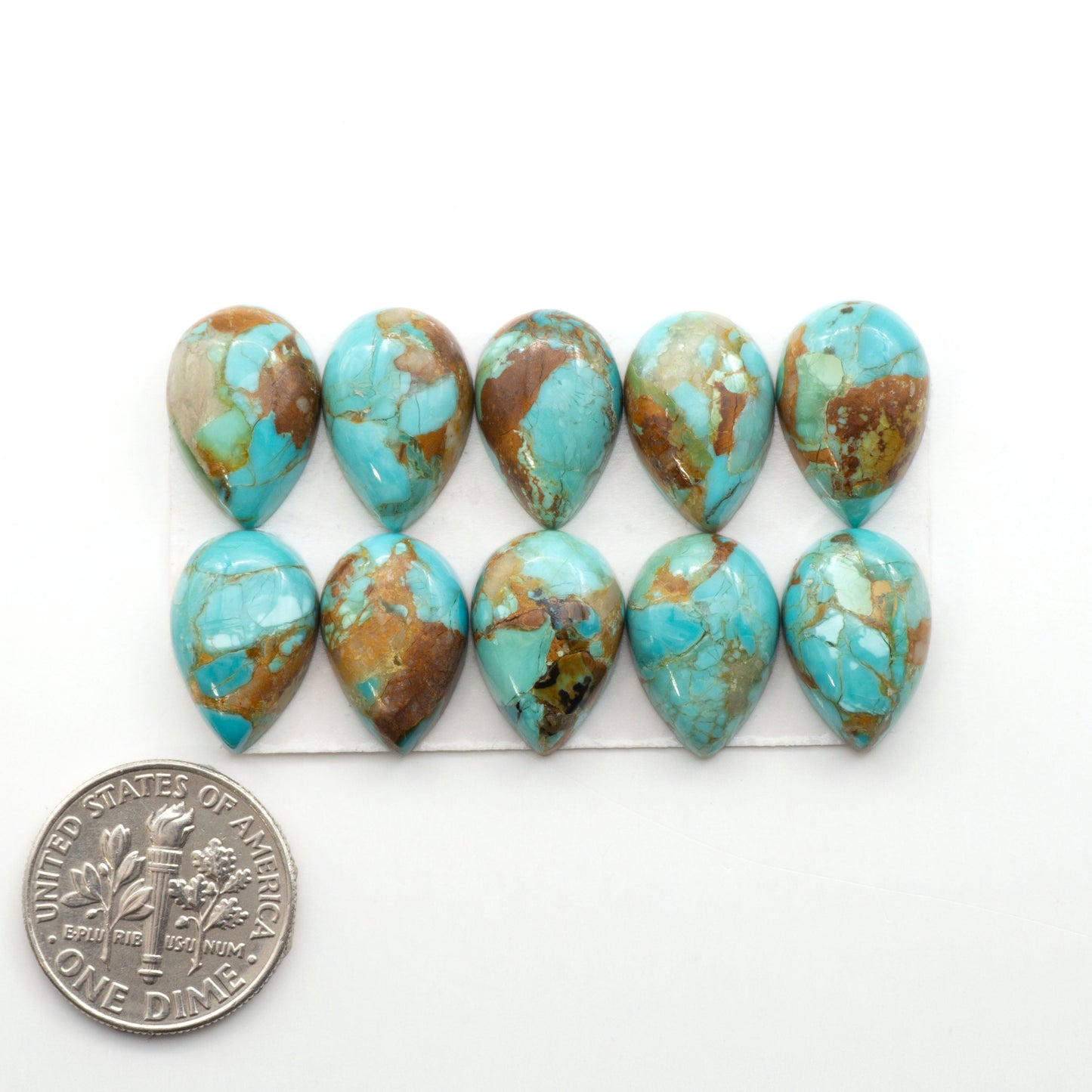 Enhance your jewelry designs with Pressed Turquoise Nugget Cabochons. Crafted from composite materials they add a captivating touch to your creations.