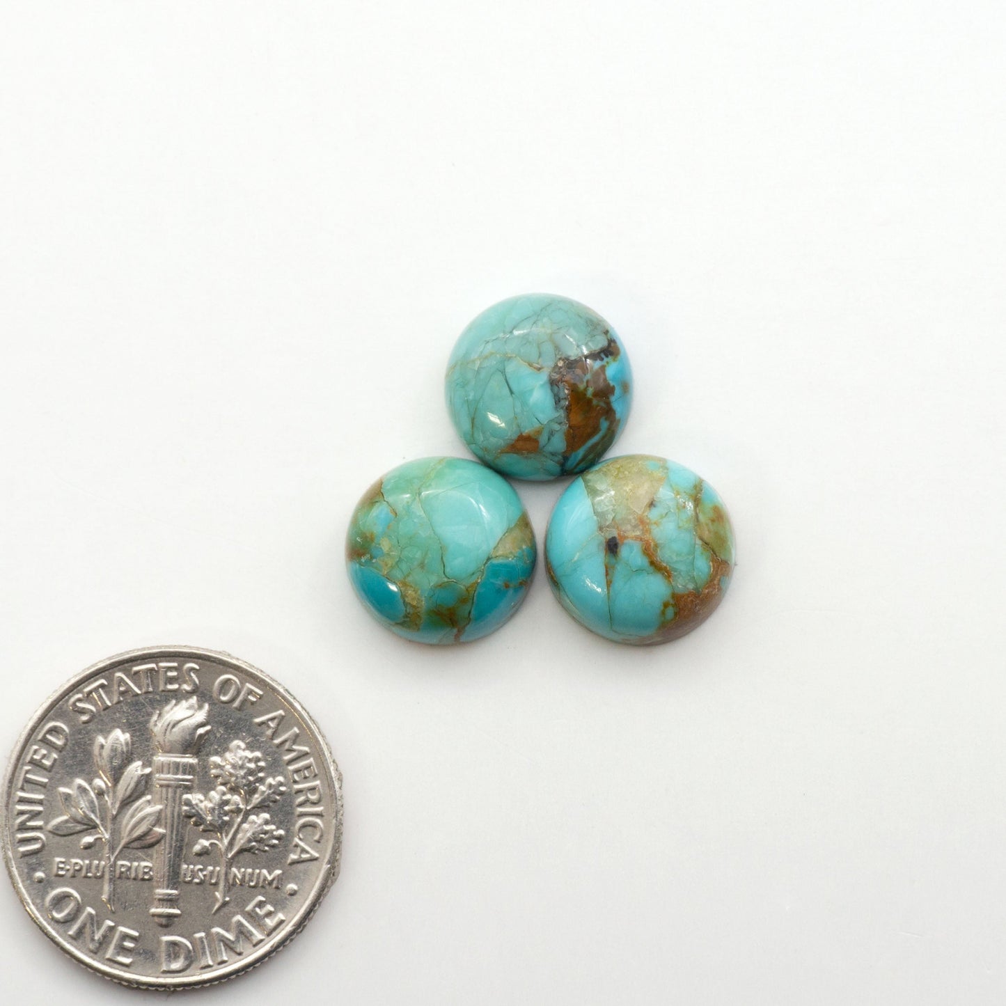 Enhance your jewelry designs with Pressed Turquoise Nugget Cabochons. Crafted from composite materials they add a captivating touch to your creations.