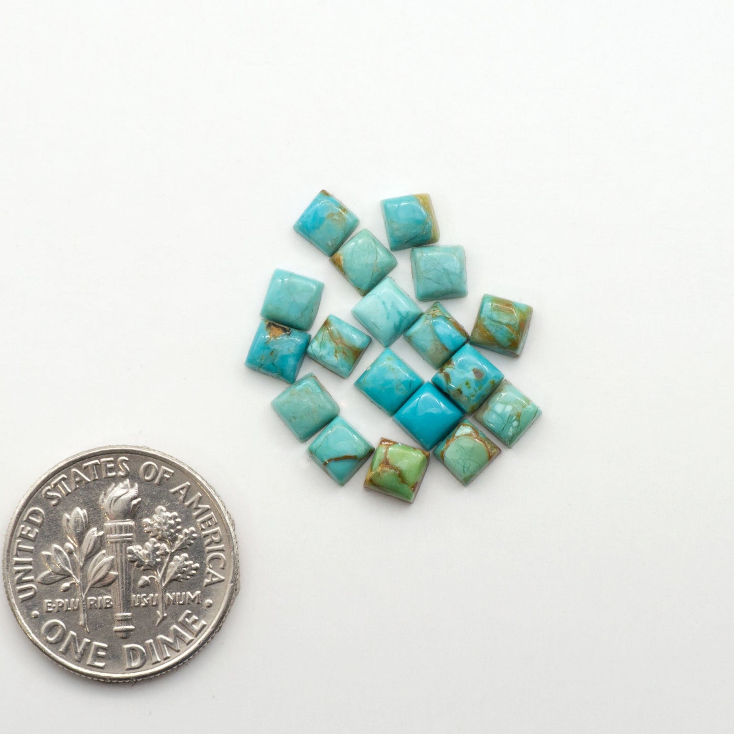Enhance your jewelry designs with Pressed Turquoise Nugget Cabochons. Crafted from composite materials they add a captivating touch to your creations.