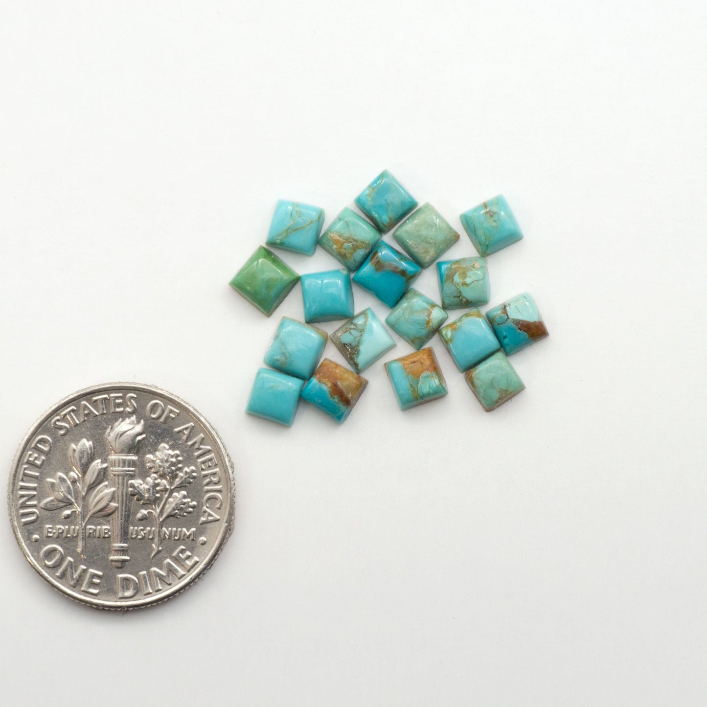 Enhance your jewelry designs with Pressed Turquoise Nugget Cabochons. Crafted from composite materials they add a captivating touch to your creations.
