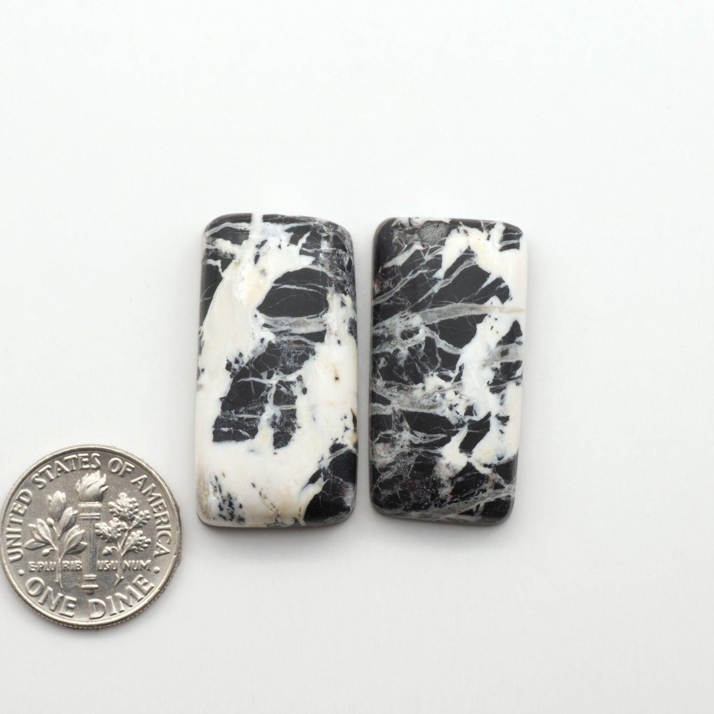 Natural White Buffalo Stone Cabochons are semi-precious gemstones cut into shapes ideal for jewelry-making, making them an excellent choice for artisans.
