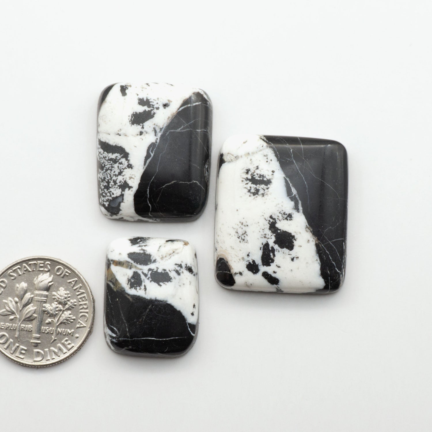 Natural White Buffalo Stone Cabochons are semi-precious gemstones cut into shapes ideal for jewelry-making, making them an excellent choice for artisans.