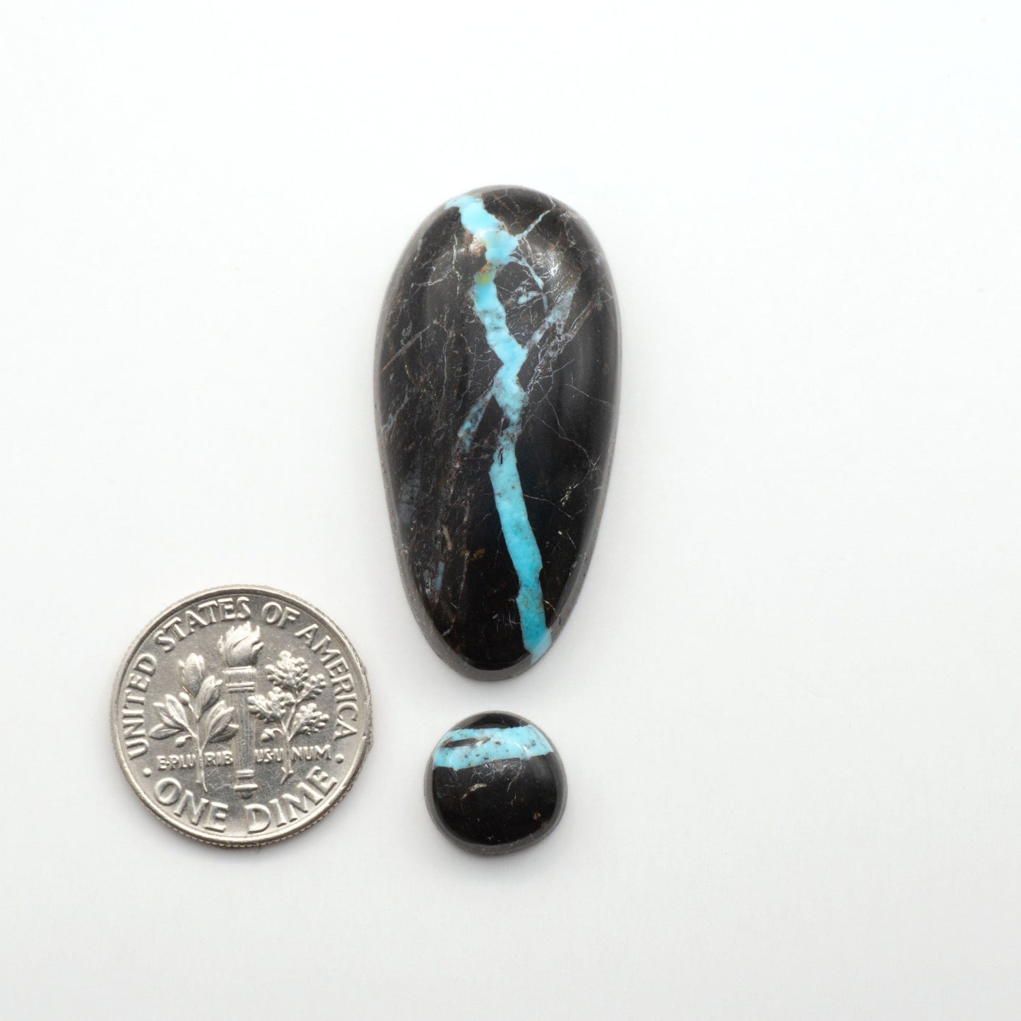 Black Jack Turquoise features a bold black color with striking veins of turquoise, making it a truly one-of-a-kind addition to your jewelry collection.