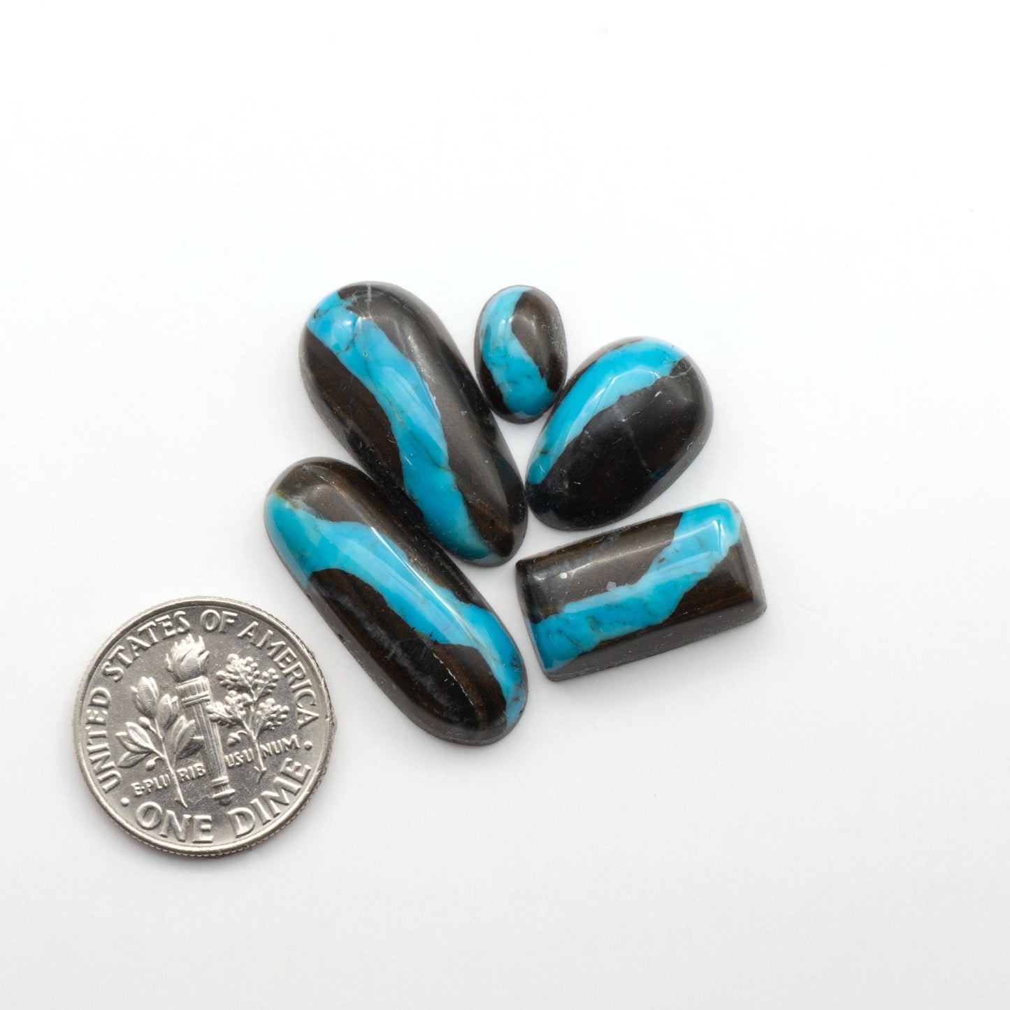 Black Jack Turquoise features a bold black color with striking veins of turquoise, making it a truly one-of-a-kind addition to your jewelry collection.