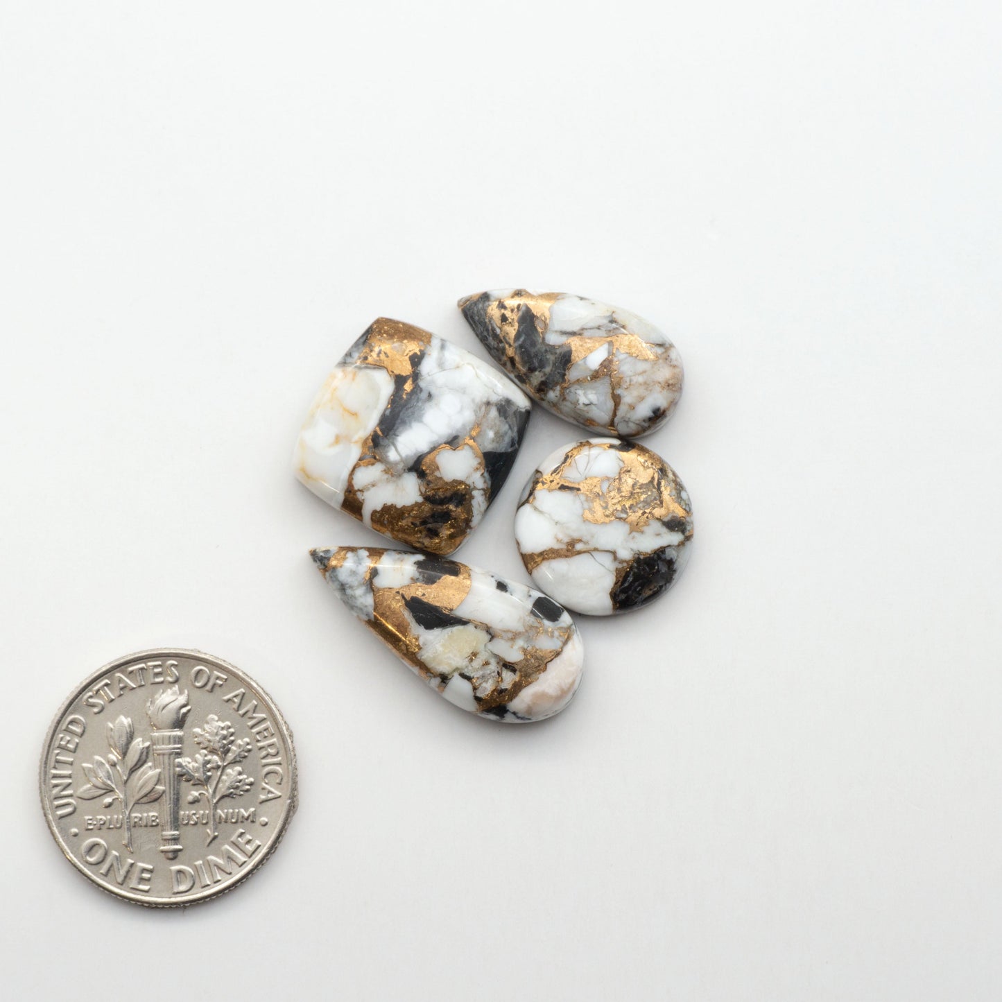 Elevate your jewelry pieces with these stunning White Buffalo Cabochons. With their unique and intricate patterns, they add a touch of elegance to any design.