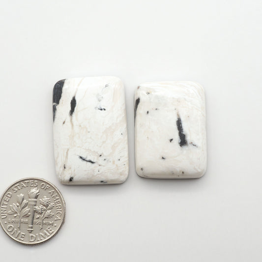 Natural White Buffalo Stone Cabochons are semi-precious gemstones cut into shapes ideal for jewelry-making, making them an excellent choice for artisans.