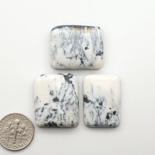 Natural White Buffalo Stone Cabochons are semi-precious gemstones cut into shapes ideal for jewelry-making, making them an excellent choice for artisans.