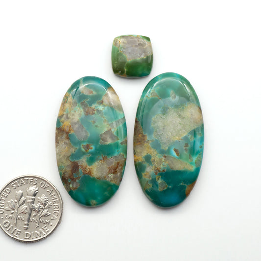 Kingman Turquoise Cabochons are a staple in the jewelry industry, known for their stunning blue-green color. Perfect for necklaces, earrings, and more!