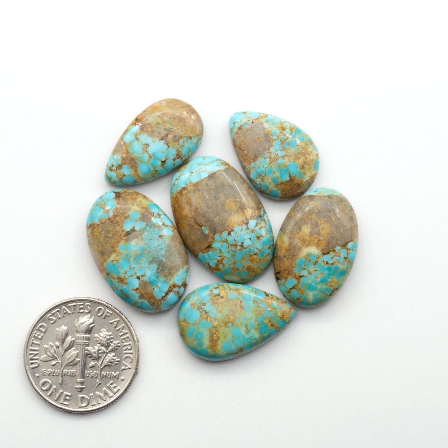 Kingman Turquoise Cabochons are a staple in the jewelry industry, known for their stunning blue-green color. Perfect for necklaces, earrings, and more!