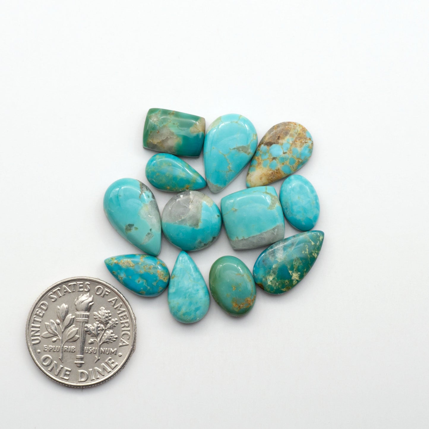 Kingman Turquoise Cabochons are a staple in the jewelry industry, known for their stunning blue-green color. Perfect for necklaces, earrings, and more!