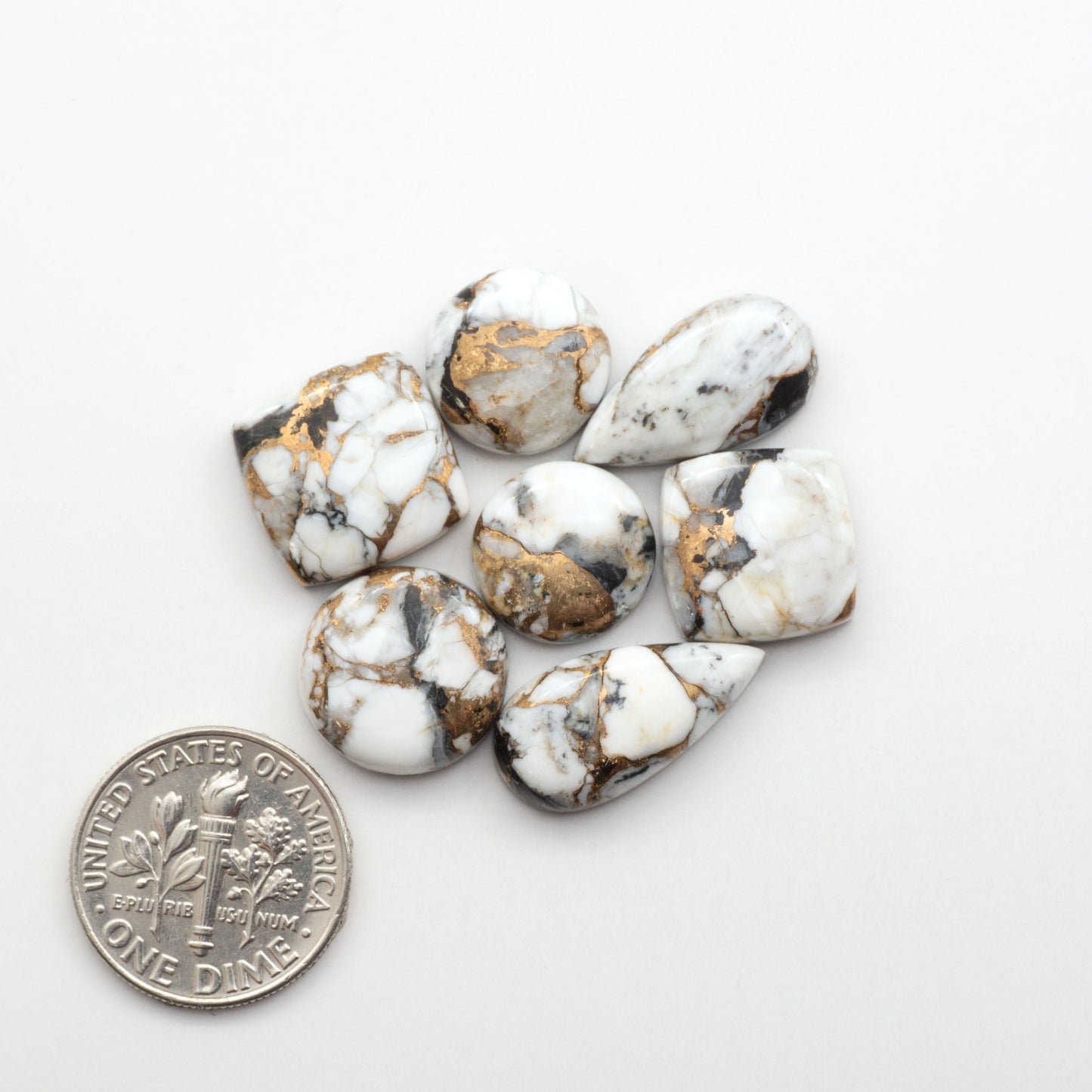 Elevate your jewelry pieces with these stunning White Buffalo Cabochons. With their unique and intricate patterns, they add a touch of elegance to any design.