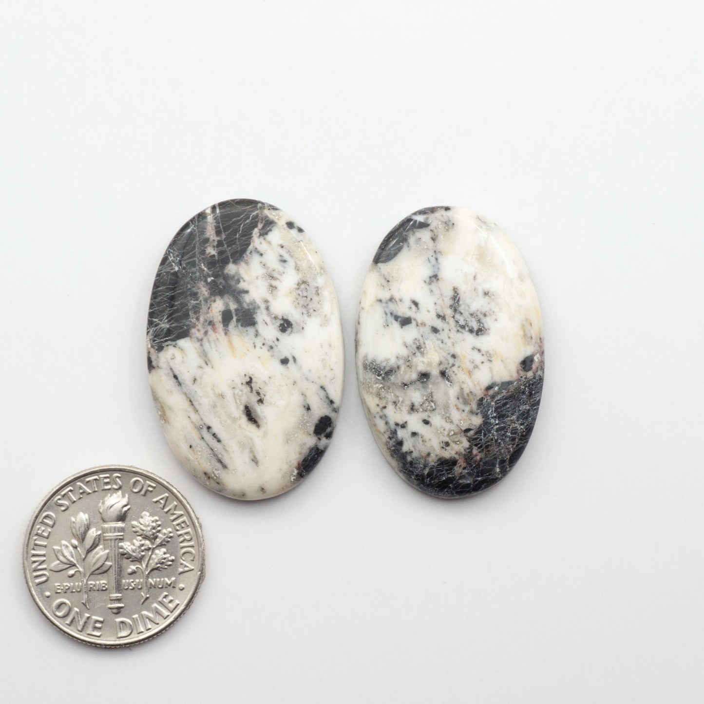 Natural White Buffalo Stone Cabochons are semi-precious gemstones cut into shapes ideal for jewelry-making, making them an excellent choice for artisans.