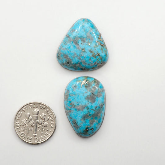 Nacozari turquoise cabochons are striking gemstones known for their vibrant blue to greenish-blue colors and pyrite, these stones are prized in jewelry making.