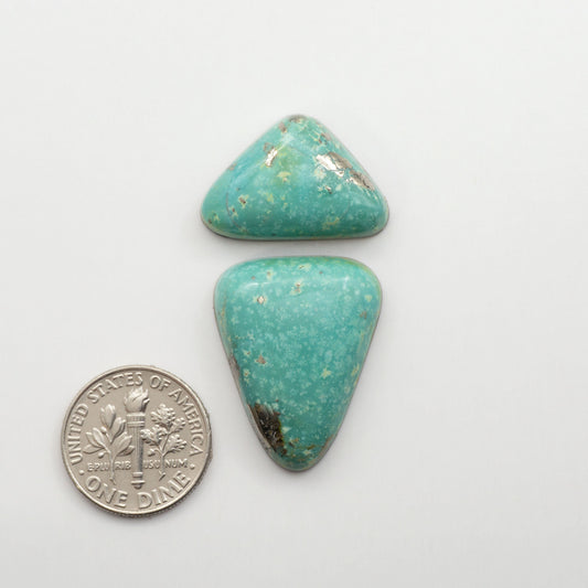Nacozari turquoise cabochons are striking gemstones known for their vibrant blue to greenish-blue colors and pyrite, these stones are prized in jewelry making.