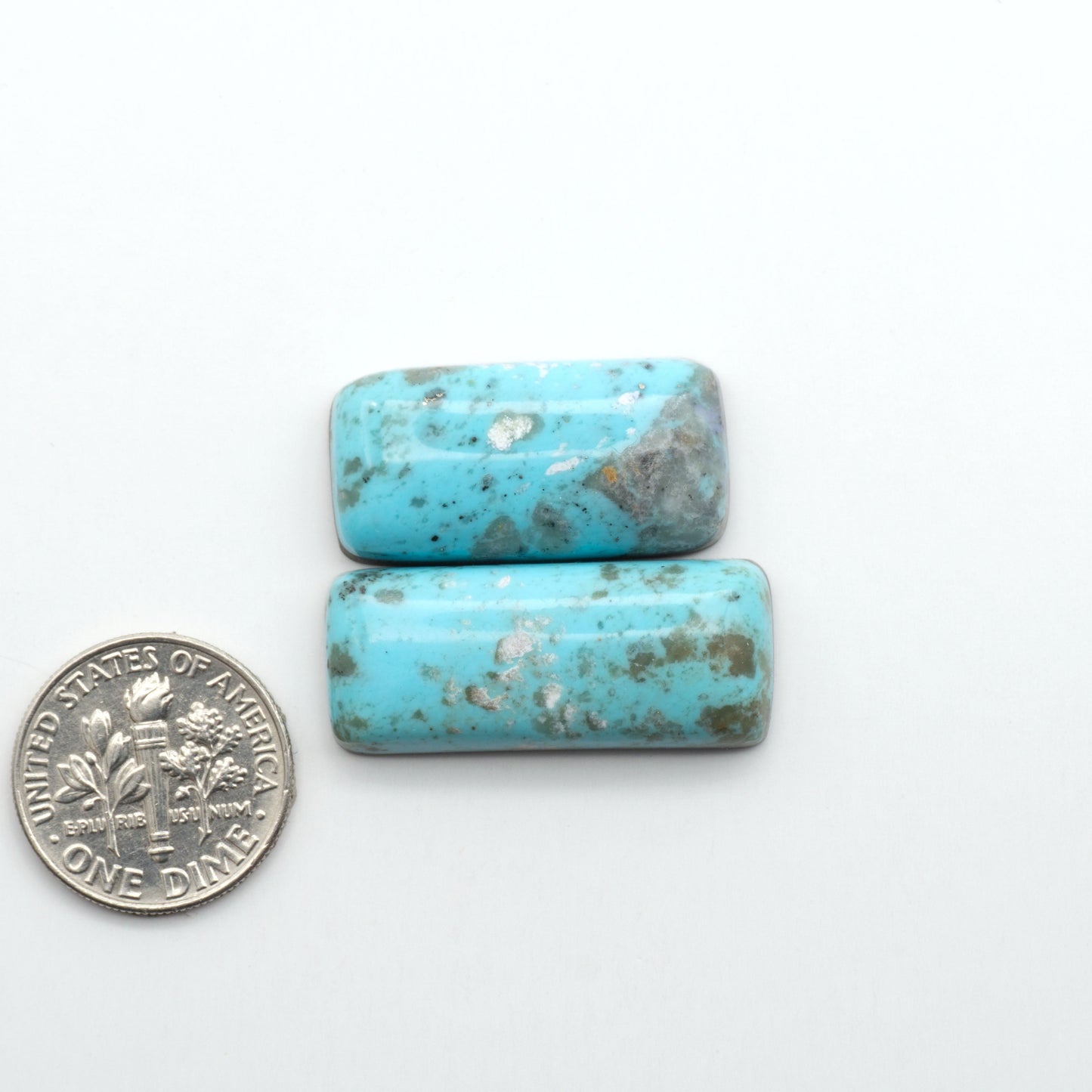 Nacozari turquoise cabochons are striking gemstones known for their vibrant blue to greenish-blue colors and pyrite, these stones are prized in jewelry making.