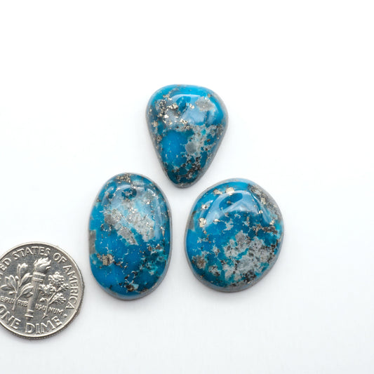 Nacozari turquoise cabochons are striking gemstones known for their vibrant blue to greenish-blue colors and pyrite, these stones are prized in jewelry making.
