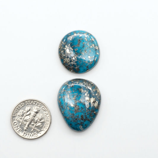 Nacozari turquoise cabochons are striking gemstones known for their vibrant blue to greenish-blue colors and pyrite, these stones are prized in jewelry making.