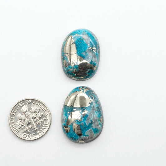 Nacozari turquoise cabochons are striking gemstones known for their vibrant blue to greenish-blue colors and pyrite, these stones are prized in jewelry making.