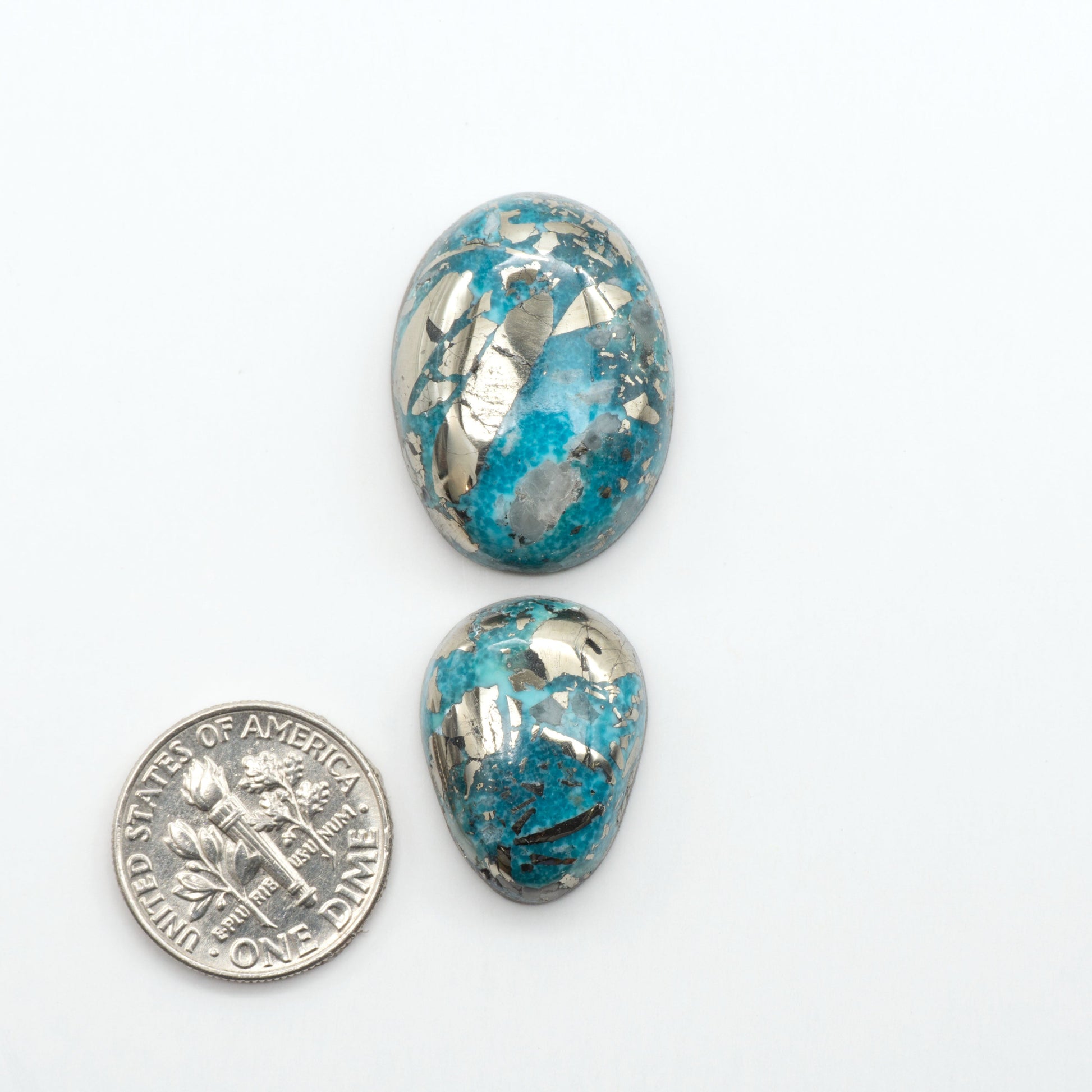 Nacozari turquoise cabochons are striking gemstones known for their vibrant blue to greenish-blue colors and pyrite, these stones are prized in jewelry making.