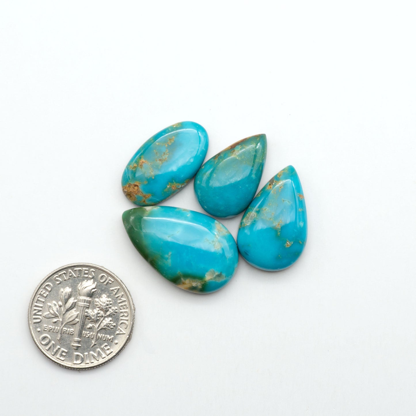 Kingman Turquoise Cabochons are a staple in the jewelry industry, known for their stunning blue-green color. Perfect for necklaces, earrings, and more!