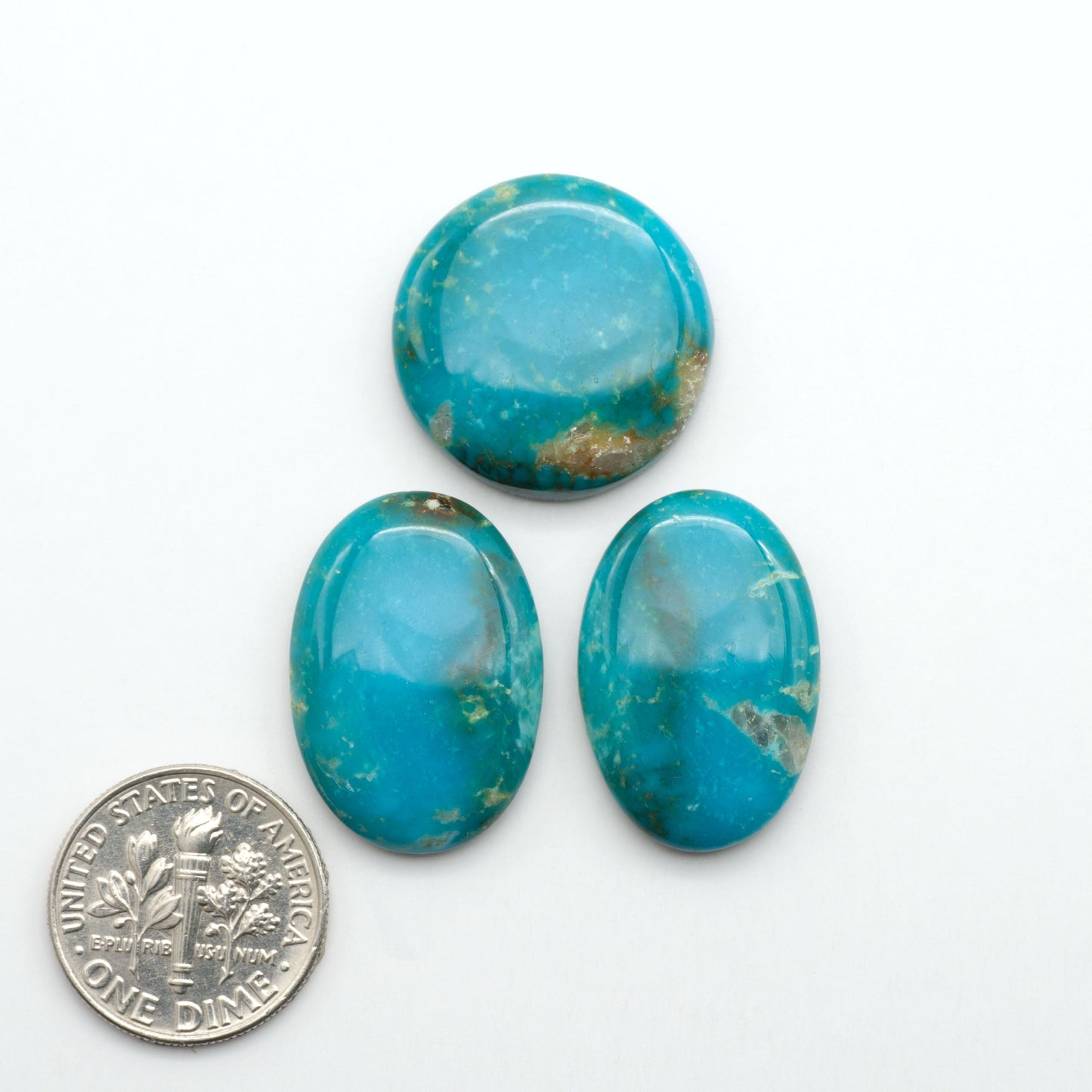 Kingman Turquoise Cabochons are a staple in the jewelry industry, known for their stunning blue-green color. Perfect for necklaces, earrings, and more!