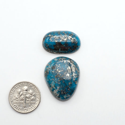 Nacozari turquoise cabochons are striking gemstones known for their vibrant blue to greenish-blue colors and pyrite, these stones are prized in jewelry making.