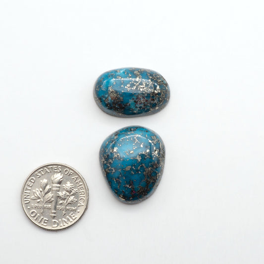 Nacozari turquoise cabochons are striking gemstones known for their vibrant blue to greenish-blue colors and pyrite, these stones are prized in jewelry making.