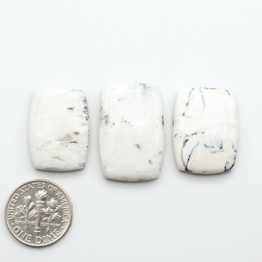 Natural White Buffalo Stone Cabochons are semi-precious gemstones cut into shapes ideal for jewelry-making, making them an excellent choice for artisans.
