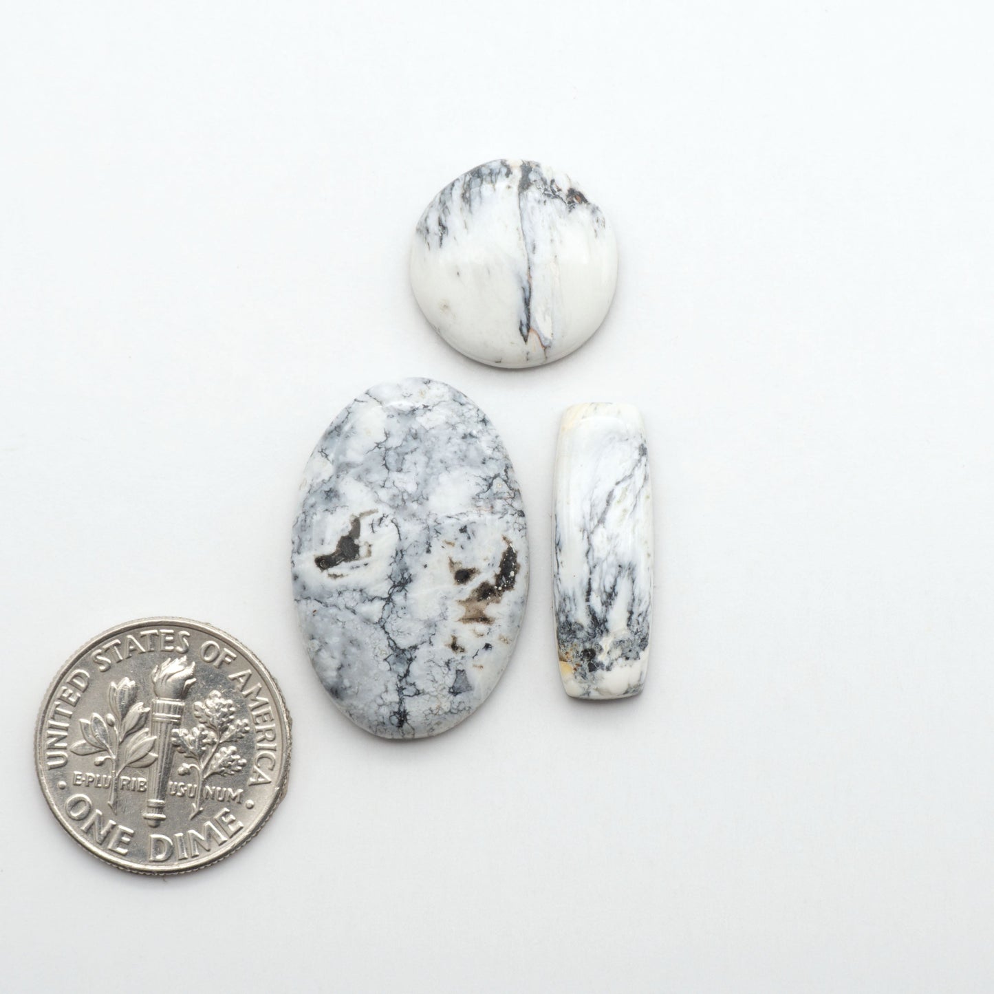 Natural White Buffalo Stone Cabochons are semi-precious gemstones cut into shapes ideal for jewelry-making, making them an excellent choice for artisans.
