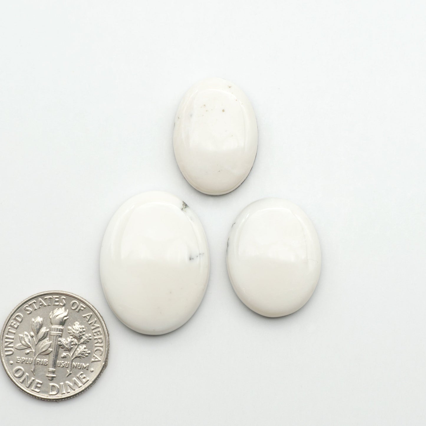 Natural White Buffalo Stone Cabochons are semi-precious gemstones cut into shapes ideal for jewelry-making, making them an excellent choice for artisans.