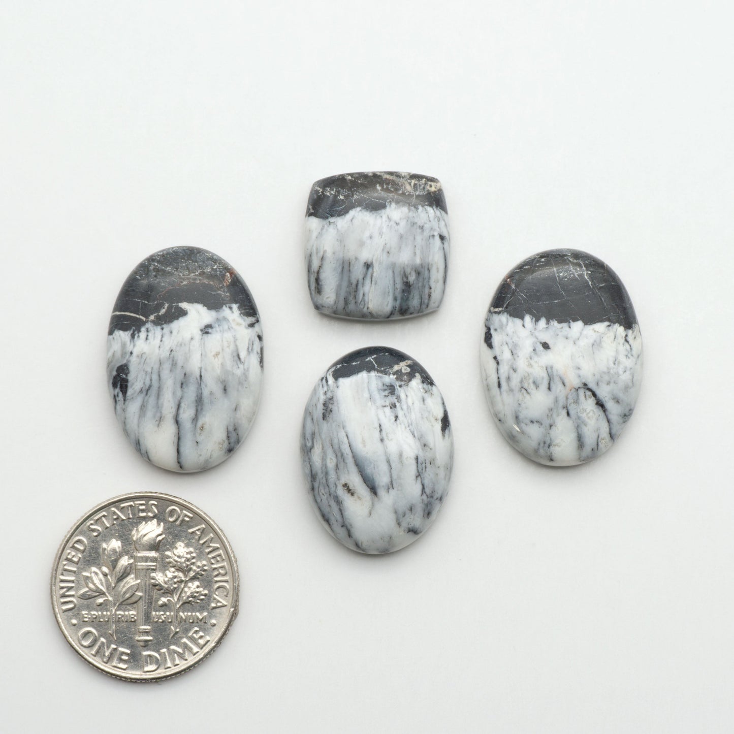 Natural White Buffalo Stone Cabochons are semi-precious gemstones cut into shapes ideal for jewelry-making, making them an excellent choice for artisans.