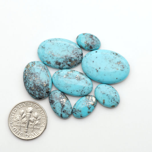 Nacozari turquoise cabochons are striking gemstones known for their vibrant blue to greenish-blue colors and pyrite, these stones are prized in jewelry making.